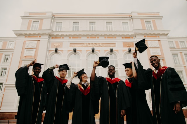 Graduates celebrating on a university campus